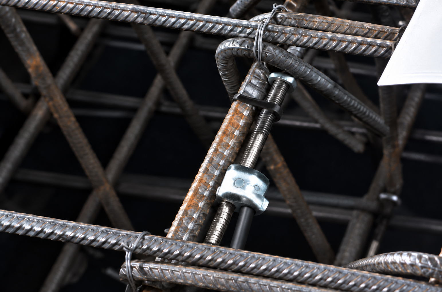 Vibrating wire embedment strain gauge mounted among reinforcement bars before concrete placement